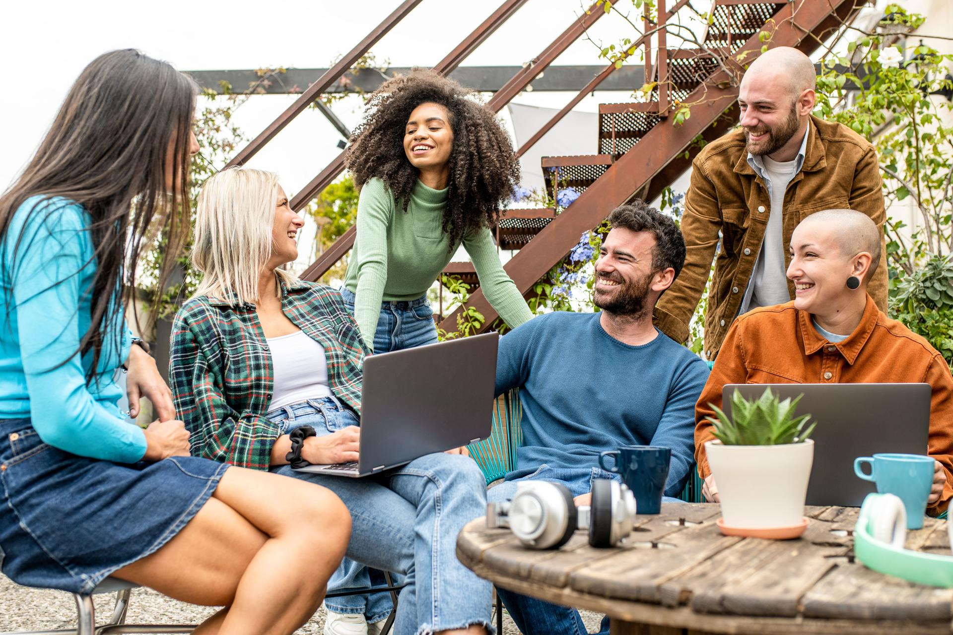 group of hypnotherapists in team work meeting,  tech life style concept with guys and girls having fun, telecommuting an remote work place concepts, young creative